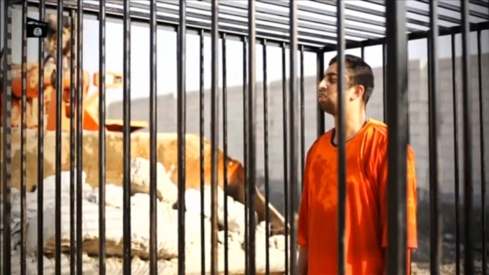 A man purported to be Islamic State captive Jordanian pilot Muath al-Kasaesbeh is seen standing in a cage in this still image from an undated video filmed from an undisclosed location made available on social media on February 3, 2015. Islamic State militants released the video on Tuesday purporting to show Kasaesbeh being burnt alive, and Jordanian state television said he was murdered a month ago. Reuters could not immediately confirm the video, which showed a man resembling the captive pilot standing in a black cage before being set ablaze.