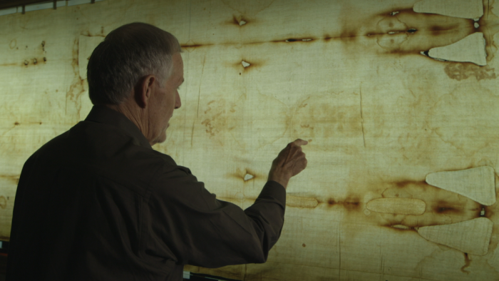 John Jackson, director of the Turin Shroud Centre of Colorado, examines the Shroud of Turin.