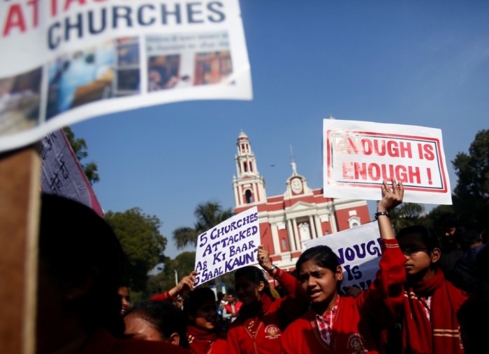 Demonstrators shout slogans as they hold placards during a protest outside a church in New Delhi, India, February 5, 2015. Hundreds of Christian protesters clashed with police in India's capital on Thursday as they tried to press demands for better government protection amid concern about rising intolerance after a series of attacks on churches.
