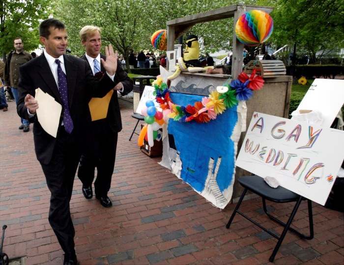 John Sullivan (L) and Chris McCary, both from Anniston, Alabama, walk away from the Provincetown, Massachusetts Town Hall with their marriage license May 17, 2004. They were the first in line to file for a license and were married later in the day. In November 2003 the Massachusetts Supreme Judicial Court ruled that Massachusetts must allow same-sex couples to marry beginning May 17, 2004.