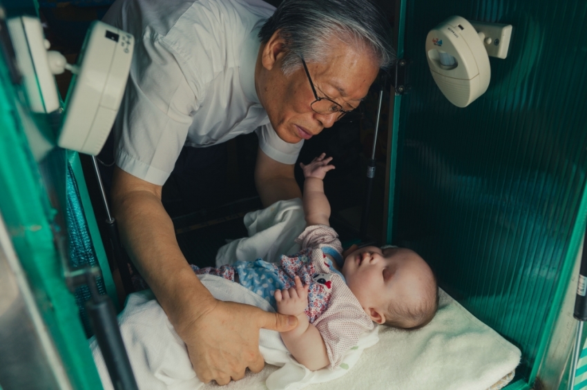 Scene from the film, "The Drop Box." South Korean Pastor Lee Jong-rak finds an abandoned baby.