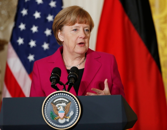 German Chancellor Angela Merkel speaks as she holds a joint news conference with U.S. President Barack Obama in the East Room of the White House in Washington, February 9, 2015.