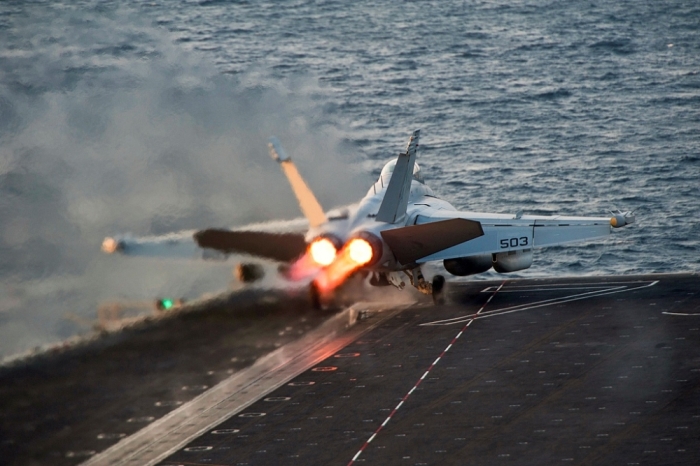 An EA-18G Growler launches from the Nimitz-class aircraft carrier USS Carl Vinson (CVN 70) in this U.S. Navy picture taken in the Arabian Gulf October 28, 2014. The United States targeted Islamic State militants on Sunday and Monday with five air strikes in Syria and nine in Iraq, according to U.S. Central Command. Picture taken October 28, 2014.