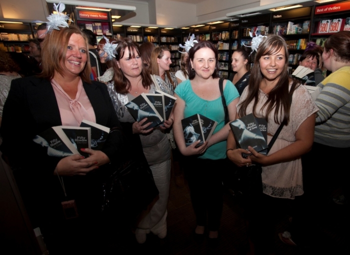 People wait for E L James, author of 'Fifty Shades of Grey,' during a book signing in London, England, September 6, 2012.