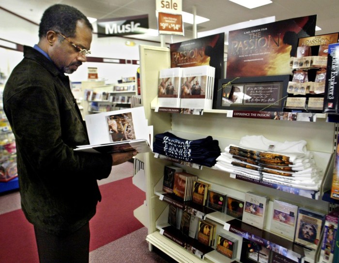 Rick Manning of Atlanta, Georgia, looks over a book and other items made about the movie 'The Passion of the Christ' at the Family Christian Bookstore in Buford, Georgia, February 25, 2004. The movie officially opened to the public on Wednesday.