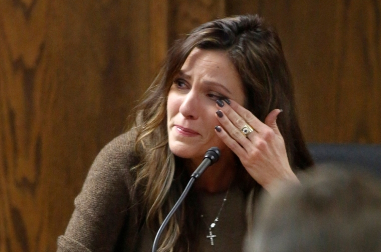 Taya Kyle, wife of slain Navy SEAL Chris Kyle, wipes away tears when viewing images of her husband during her testimony on the witness stand during the opening day of the capital murder trial of former Marine Eddie Ray Routh at the Erath County Donald R. Jones Justice Center in Stephenville, Texas, February 11, 2015. Former Marine Eddie Ray Routh, 27, is charged with murdering Kyle, who was credited with the most kills of any U.S. sniper, and Kyle's friend Chad Littlefield in 2013.