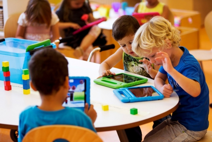 Students play with their iPads at the Steve Jobs school in Sneek, August 21, 2013. The Steve Jobs schools in the Netherlands are founded by the Education For A New Time organization, which provides the children with iPads to help them learn with a more interactive experience.