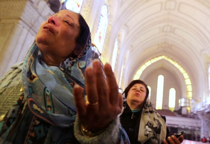 Coptic Christian women attend at the Coptic mass prayers for the Egyptians beheaded in Libya, at Saint Mark's Coptic Orthodox Cathedral in Cairo, February 17, 2015.