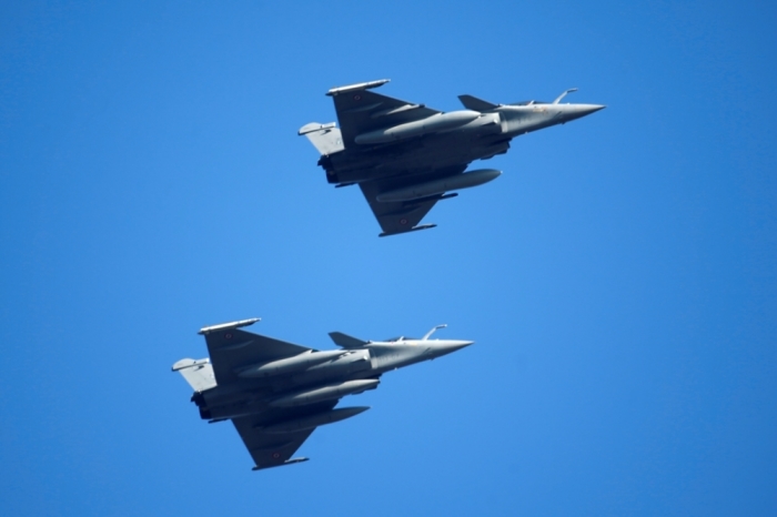 Two Rafale fighter jets fly over their air base in Saint-Dizier, February 13, 2015. France's President said Egypt would order 24 Rafale fighter jets, a naval frigate and related military equipment in a deal to be signed in Cairo on Monday worth more than 5 billion euros (.70 billion). The contract would make Egypt, aiming to upgrade its military hardware amid fears the crisis in neighboring Libya could spill over, the first export customer for the warplane, built by Dassault Aviation.