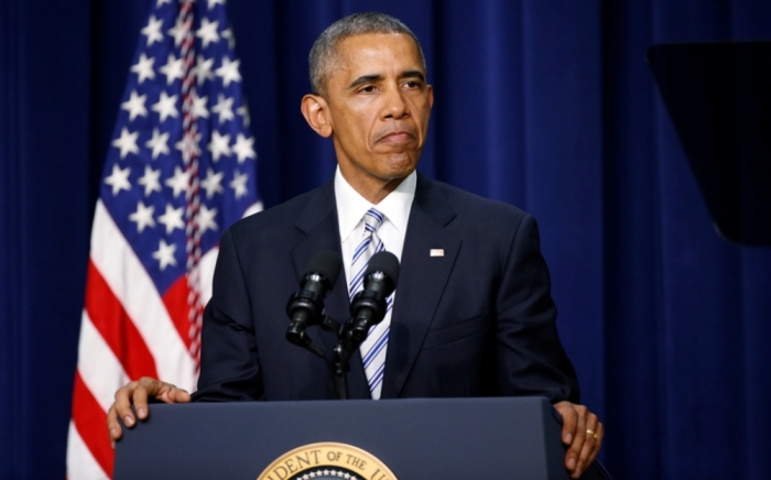 U.S. President Barack Obama pauses while addressing the White House Summit on Countering Violent Extremism in Washington, February 18, 2015.
