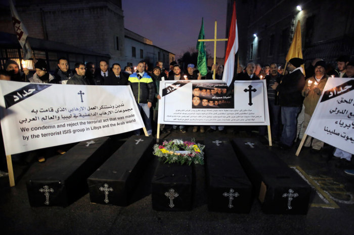 Coptic Christians pray at a symbolic funeral for the 21 Egyptian Christians who were beheaded by Islamic State earlier this week, in Jerusalem's Old City February 18, 2015. Egypt directly intervened for the first time in the conflict in neighbouring Libya on Monday after Islamic State released a video showing the beheading of 21 Egyptian Christians.