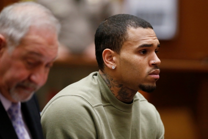 Singer Chris Brown (R), who pleaded guilty to assaulting his former girlfriend Rihanna, appears in court with his lawyer Mark Geragos for a progress hearing, in Los Angeles, California, January 15, 2015.