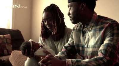 This video still from a CBN feature shows Jackie Hill-Perry and husband, Preston Perry, with their daughter, Eden.