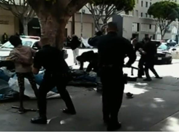 A screenshot of a fatal shooting of a homeless man in response to robbery in Los Angeles, March 1, 2015.