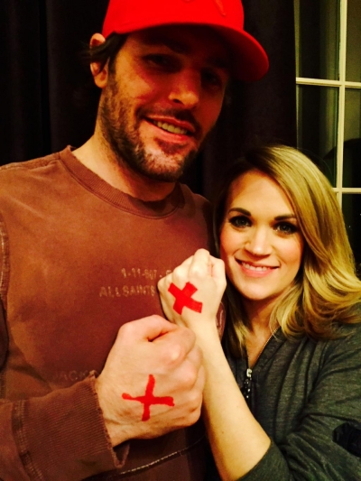 Carrie Underwood and Mike Fisher show their support of the #EndItMovement' on Feb. 26, 2015.