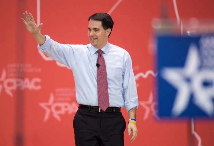 Governor Scott Walker, R-Wis., waves as he arrives to speak at the 42nd annual Conservative Political Action Conference in National Harbor, Maryland, February 26, 2015.
