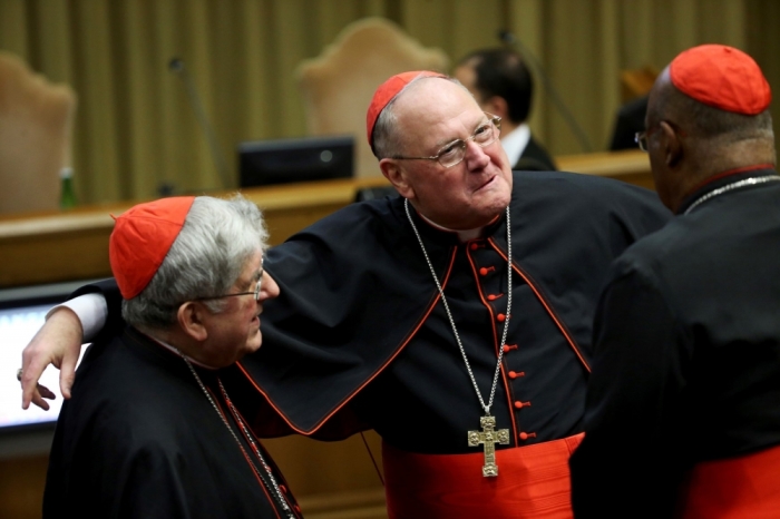 Cardinal Timothy Dolan (C) attends a consistory led by Pope Francis at the Vatican, Rome, Italy, February 12, 2015. Pope Francis, starting two days of closed-door meetings with the world's Roman Catholic cardinals, on Thursday called for greater efficiency and transparency in the Church's troubled central administration, the Curia.