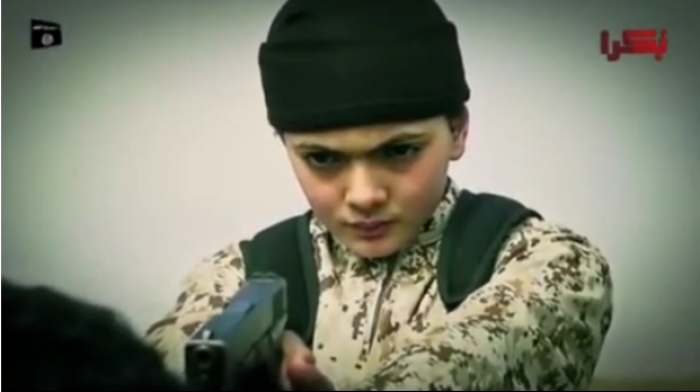A young boy reportedly executes an alleged Israeli spy in an ISIS propaganda video released by the Islamic State on March 10, 2015.