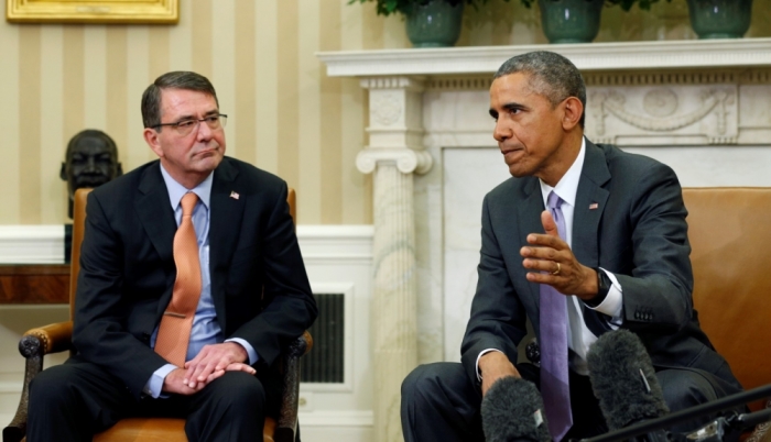 U.S. President Barack Obama speaks about Iran during his meeting with Secretary of Defense Ash Carter (L) in the Oval Office of the White House in Washington March 3, 2015.