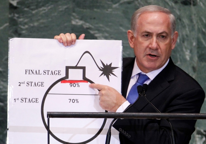 Israel's Prime Minister Benjamin Netanyahu points to a red line he drew on the graphic of a bomb used to represent Iran's nuclear program as he addresses the 67th United Nations General Assembly at the U.N. Headquarters in New York, September 27, 2012. The red line represents a point where he believes the international community should tell Iran that they will not be allowed to pass without intervention.