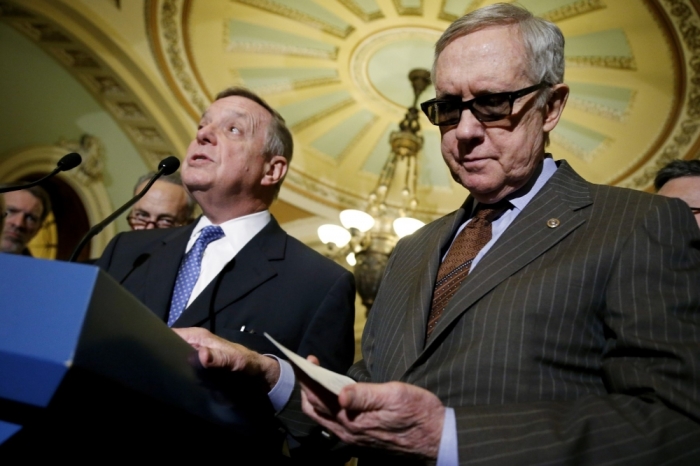 U.S. Senator Richard Durbin, D-Ill., (L) and Senate Minority Leader Harry Reid, D-Nev., (R) hold a news conference after weekly party caucus policy luncheons at the U.S. Capitol in Washington, March 10, 2015.