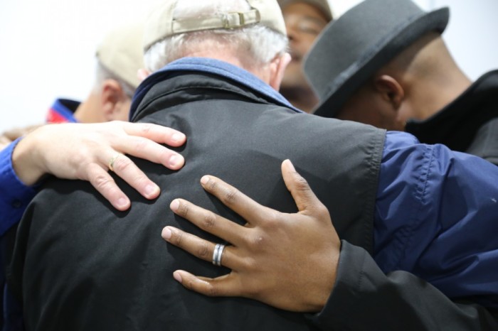 Billy Graham Rapid Response Team chaplains pray with Ferguson residents late last year. The chaplains returned to Ferguson last week after violence erupted there again.