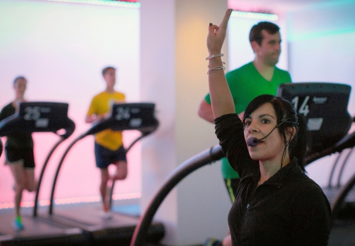 Jessica Desmond, an instructor at the Mile High Run Club, leads a class in a Manhattan borough of New York, November 14, 2014. A New York City fitness studio is following fast on the heels of the indoor cycling, or spin, craze by beckoning outdoor runners to come in from the cold for group treadmill classes. Equipped with 30 treadmills, lighting evocative of dusk or dawn, and group training designed to hone the skills of marathoners and newbies alike, fitness experts say MHRC might do a bit to burnish the image of the most used, least glamorous, of gym cardio machines.