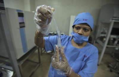An embryologist carries-out a sample preparation process at Fortis Bloom Fertility and IVF Centre inside the Fortis hospital at Mohali in the northern Indian state of Punjab, June 13, 2013.