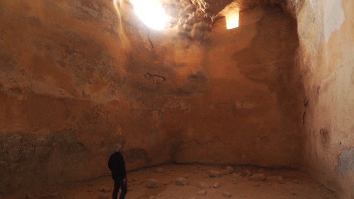 Dr. James Tabor stands inside one of the enormous cisterns that supplied Masada with water.