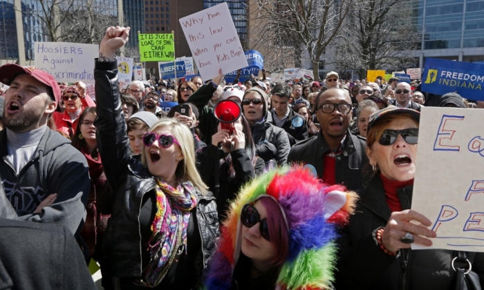 Demonstrators gather to protest a controversial religious freedom bill recently signed by Governor Mike Pence, during a rally in Indianapolis March 28, 2015. More than 2,000 people gathered at the Indiana State Capital Saturday to protest Indiana?s newly signed Religious Freedom Restoration Act saying it would promote discrimination against individuals based on sexual orientation.