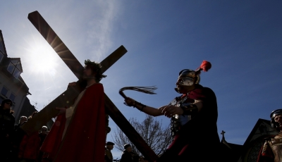 Members of the Italian community take part in a re-enactment of the crucifixion of Jesus Christ on Good Friday in Bensheim, southwest of Frankfurt.