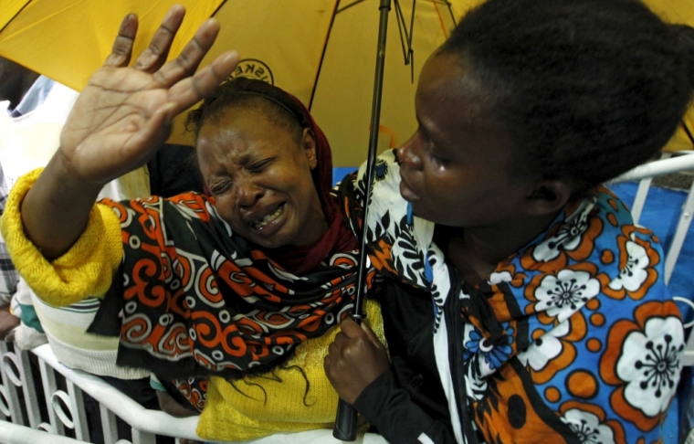 A woman reacts after seeing her son who was rescued from the Garissa University attack in Kenya's capital Nairobi, April 4, 2015, following Thursday's siege by gunmen in their campus in Garissa. Kenya's President Uhuru Kenyatta said on Saturday that those behind an attack in which al-Shabaab Islamist militants killed 148 people at a university were 'deeply embedded' in Kenya, and called on Kenyan Muslims to help prevent radicalization. The stadium is now a crisis center manned by the Red Cross, for families to find out whether their relatives are alive or dead.