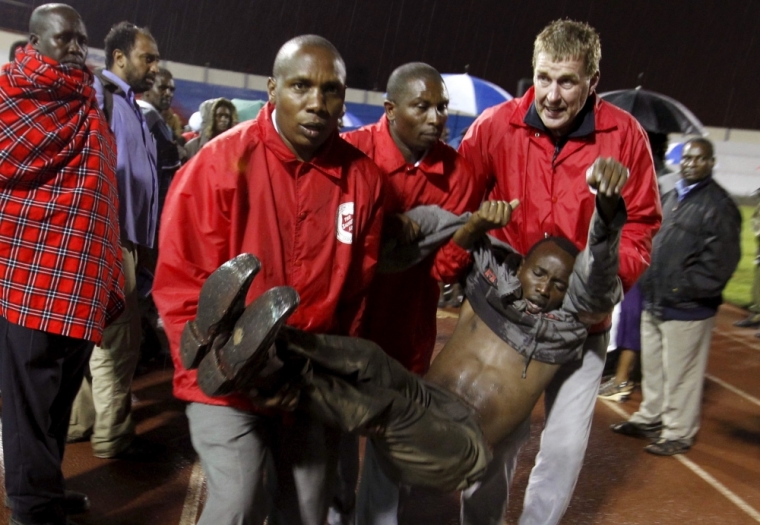A rescued Garissa University student is carried by paramedics for treatment after arriving at Nyayo stadium to meet his relatives in Kenya's capital Nairobi, April 4, 2015, after Thursday's attack by gunmen in their campus in Garissa. Kenya's President Uhuru Kenyatta said on Saturday that those behind an attack in which al-Shabaab Islamist militants killed 148 people at a university were 'deeply embedded' in Kenya, and called on Kenyan Muslims to help prevent radicalization. The stadium is now a crisis center manned by the Red Cross, for families to find out whether their relatives are alive or dead.