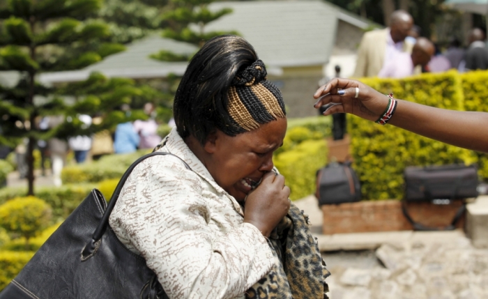 A woman mourns after viewing the body of her kin killed in Thursday's attack by gunmen, at the Chiromo Mortuary in the capital Nairobi, April 4, 2015. Somali militants vowed on Saturday to wage a long war against Kenya and run its cities 'red with blood' after the group's fighters killed nearly 150 people during an assault on a Kenyan university.