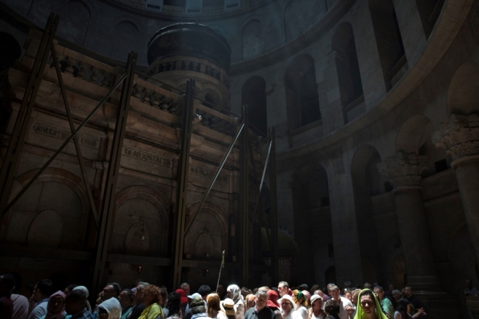Pilgrims wait in line to enter the tomb where Christians believe Jesus was buried, inside the rotunda of the Church of the Holy Sepulchre in Jerusalem's Old City, May 20, 2014. For as long as Christians have been coming to the Holy City, they have retraced the final steps of Jesus during his Passion. Fourteen stations of the cross are marked along a meandering pathway through bustling markets, streets crowded with praying pilgrims and shoppers, as well as residents, and devotees of the world's major religions. Pope Francis will pray at the church during his visit to Jordan, the Palestinian Territories and Israel between May 24 to May 26, on his first trip as pope to the region.