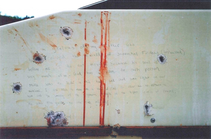 A blood-stained message that prosecutors say Boston Marathon bombing suspect Dzhokhar Tsarnaev wrote on the inside of a boat is seen with bullet holes in an undated evidence picture shown to jurors in Boston, March 10, 2015. Tsarnaev, 21, is accused of killing three people and injuring 264 with a pair of homemade bombs at the race's crowded finish line on April 15, 2013, as well as fatally shooting a police officer three days later as he and his brother Tamerlan Tsarnaev tried to flee the city.