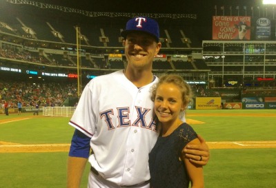 Professional baseball player Jon Edwards and his wife Katelyn pose near the mound in Arlington, Texas.