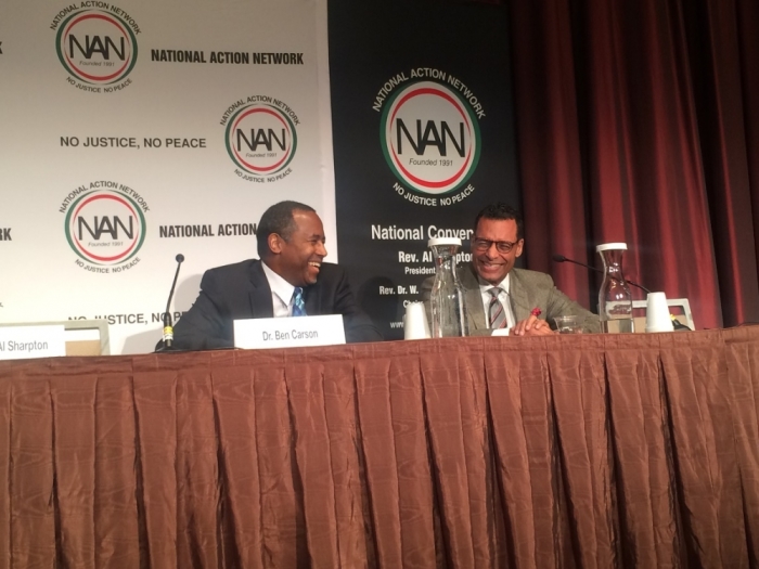 Neurosurgeon Ben Carson (L) shares a light moment with pastor A.R. Bernard of Brooklyn's Christian Cultural Center at the National Action Network's convention in Manhattan, New York, on Wednesday, April 8, 2015.