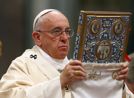 Pope Francis blesses the missal as he leads a mass on the 100th anniversary of the Armenian mass killings, in St. Peter's Basilica at the Vatican April 12, 2015. Pope Francis on Sunday commemorated the 100th anniversary of the massacre of as many as 1.5 million Armenians as 