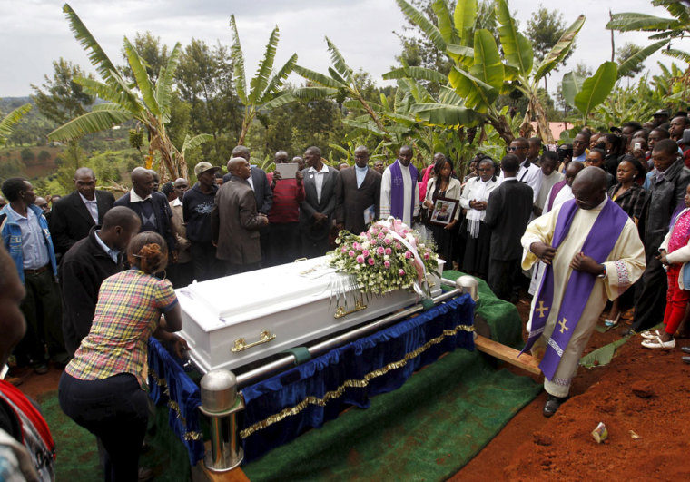 Mourners bury the coffin containing the body of Angela Nyokabi, a student killed during an attack by gunmen at Garissa University, in Wanugu village, Gatundu near Kenya's capital Nairobi April 10, 2015. Days after Islamists killed 148 people at Garissa university, Kenya's president held out an olive branch to Muslims and urged them to join Nairobi in the struggle against militant Islam by informing on sympathizers.