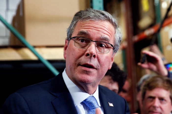 Former Florida Governor Jeb Bush talks to the media after visiting Integra Biosciences during a campaign stop in Hudson, New Hampshire, March 13, 2015.