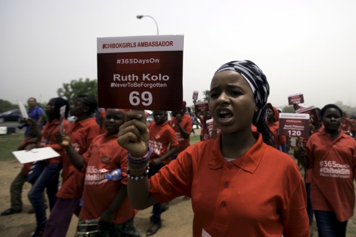 A girl holds a sign during a march to mark the one-year anniversary of the mass kidnapping of more than 200 schoolgirls from a secondary school in Chibok by Boko Haram militants, in Abuja, April 14, 2015. Nigeria's President-elect Muhammadu Buhari vowed on Tuesday to make every effort to free the schoolgirls abducted by Boko Haram militants a year ago but admitted it was not clear whether they would ever be found. A march is expected to be held in Abuja on Tuesday to mark the anniversary.