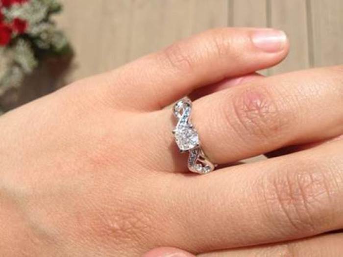 Michaela Bates shows off her engagement ring from Brandon Keilen.