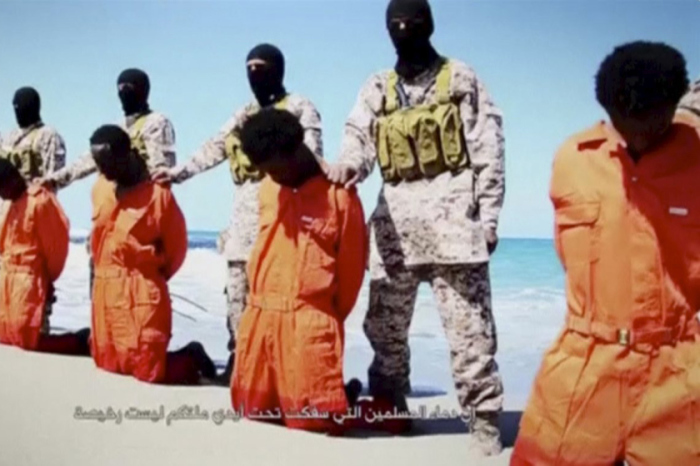 ISIS militants preparing to execute a group of Ethiopian Christians in Libya in a video released on April 19, 2015.