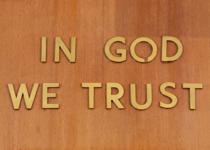 'In God We Trust' is inscribed above the judge's chair in Part 31, Room 1333 of the New York State Supreme Court, Criminal Term at 100 Centre Street, in New York, February 3, 2012.