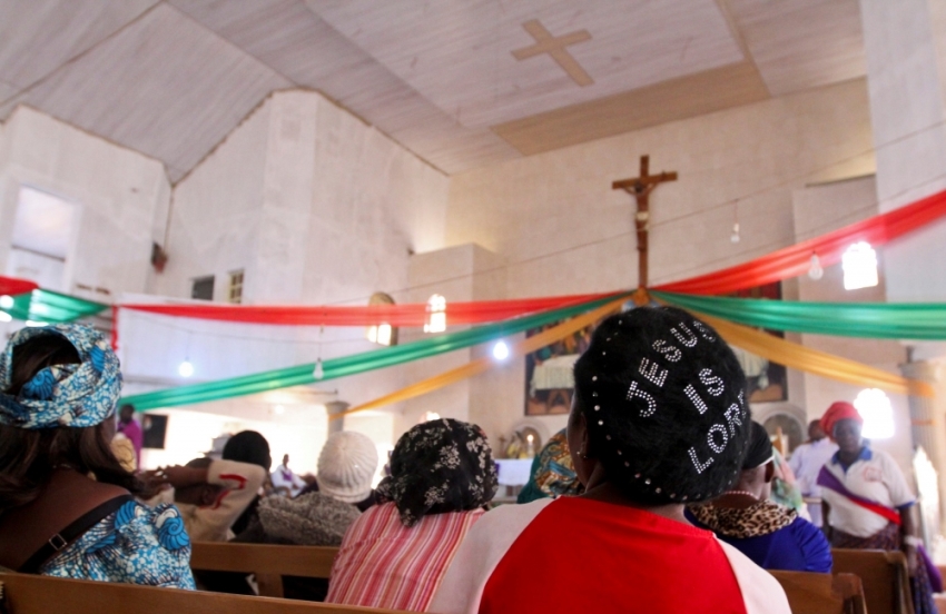 Members attend a memorial church service for victims of a suicide bomb attack at St. Theresa's Church in Madalla, on the outskirts of Nigeria's capital Abuja, December 23, 2012. Boko Haram has killed hundreds in its campaign to impose sharia law in northern Nigeria and is the biggest threat to stability in Africa's top oil exporter.This Christmas, the police and military are expecting more trouble in the north. They've ordered security to be tightened, people's movement restricted and churches to be guarded.But such is the commitment to religion in a country with Africa's largest Christian population that millions of people will pack out thousands of churches in the coming days. It is impossible to protect everyone, security experts say. Picture taken December 23, 2012.