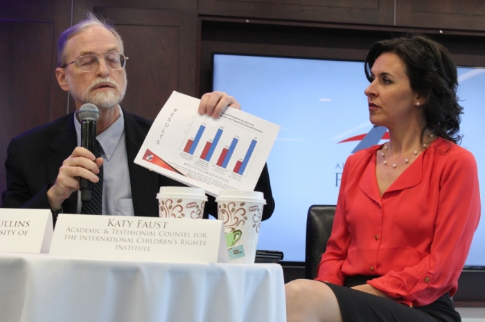The Rev. Dr. D. Paul Sullins (left) explains his chart which compares child emotional problems between children of opposite-sex and same-sex parent families using data compiled by the U.S. National Health Interview Survey. The children of same-sex families are the blue bars.