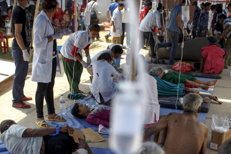 Earthquake victims receive medical treatment outside the overcrowded Dhading hospital, in the aftermath of Saturday's earthquake, in Dhading Besi, Nepal April 27, 2015.