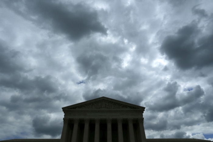 A cloudy sky aboce the U.S. Supreme Court building the day before arguments in the same-sex marriage case Obergefell v. Hodges, is pictured in Washington, April 27, 2015. The U.S. Supreme Court will hear a potentially historic case on Tuesday over the legality of same-sex marriage, in oral arguments that will cap more than two decades of litigation over the issue. Based on how the court has ruled during the past two years, there's a sense of inevitability in the air that a majority is on the verge of declaring gay marriage legal across the U.S. The case, Obergefell v. Hodges, comes amid a transformation in U.S. public attitudes towards gay marriage. The court's arguments on Tuesday over same-sex marriage will cap more than two decades of litigation and a transformation in public attitudes.