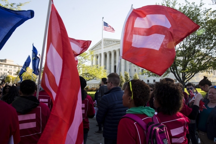 Gay marriage supporters rally in front of the Supreme Court before a hearing about gay marriage in Washington, April 28, 2015. The nine justices will be hearing arguments concerning gay marriage restrictions imposed in Kentucky, Michigan, Ohio and Tennessee, four of the 13 states that still outlaw such marriages.